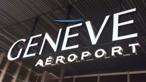 Geneva Airport main entrance sign – Genève Aéroport Entrance sign of Geneva Airport – Genève Aéroport terminal in Switzerland
